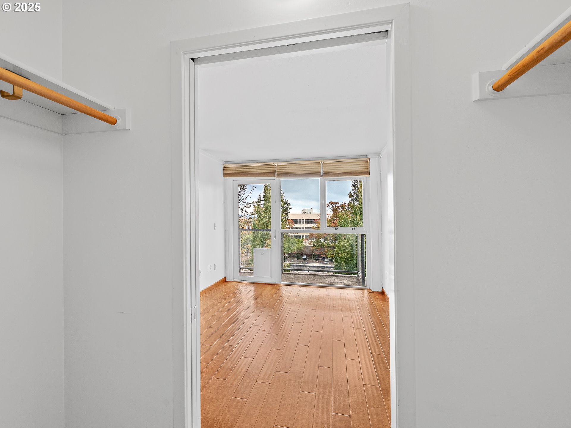 533 Northeast Holladay Street, Unit 605 Portland, OR 97232 - Photo 26 of 42 a view of a room with wooden floor and a window