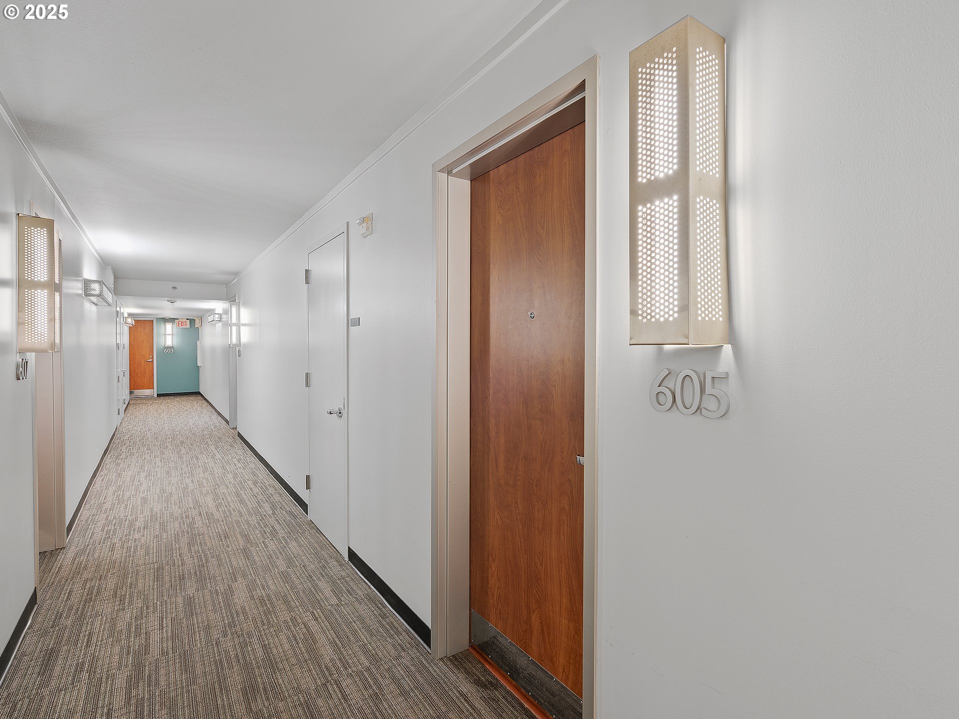 533 Northeast Holladay Street, Unit 605 Portland, OR 97232 - Photo 30 of 42 a view of hallway with wooden floor