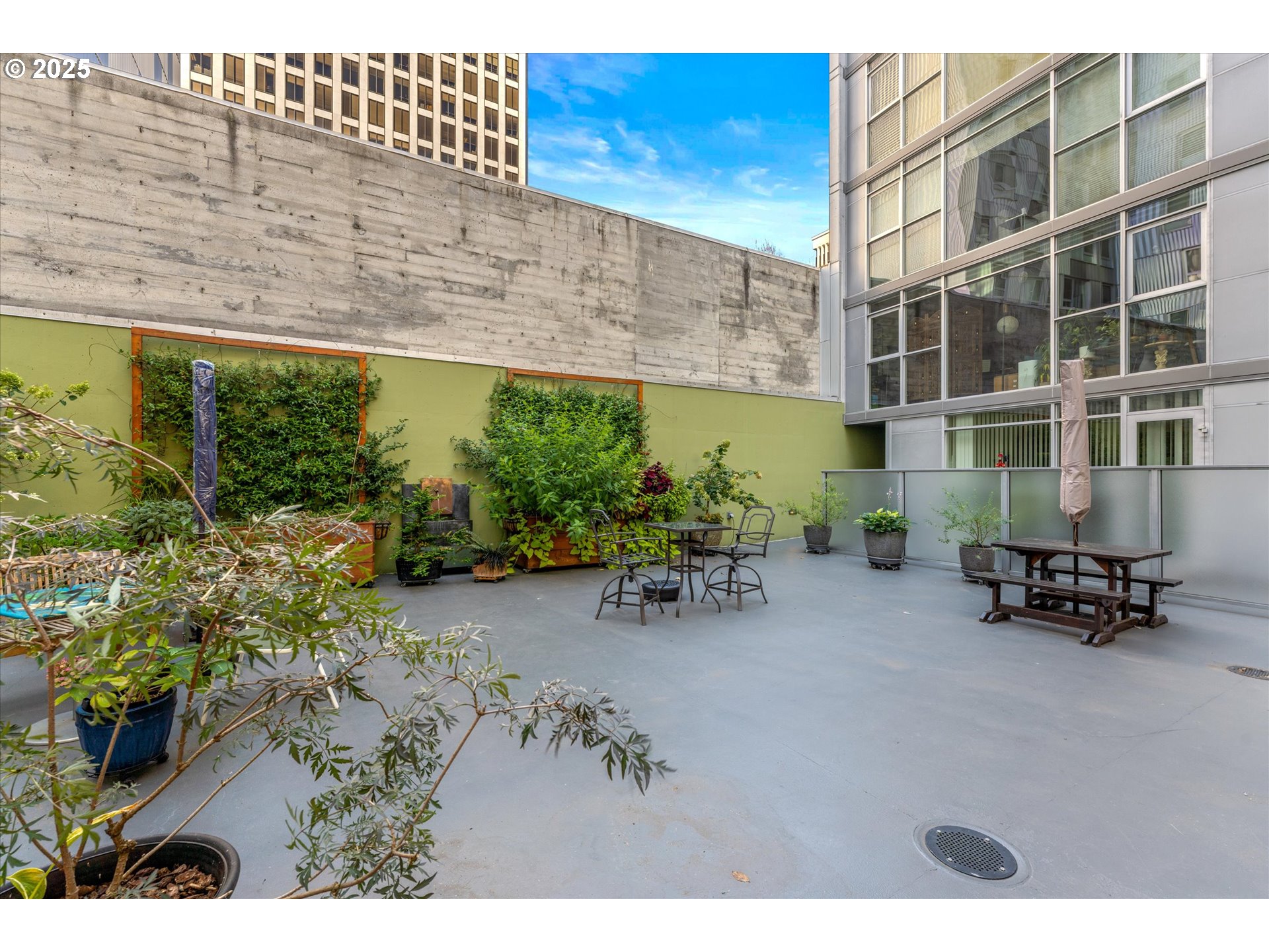 533 Northeast Holladay Street, Unit 605 Portland, OR 97232 - Photo 32 of 42 a backyard of a building with outdoor seating