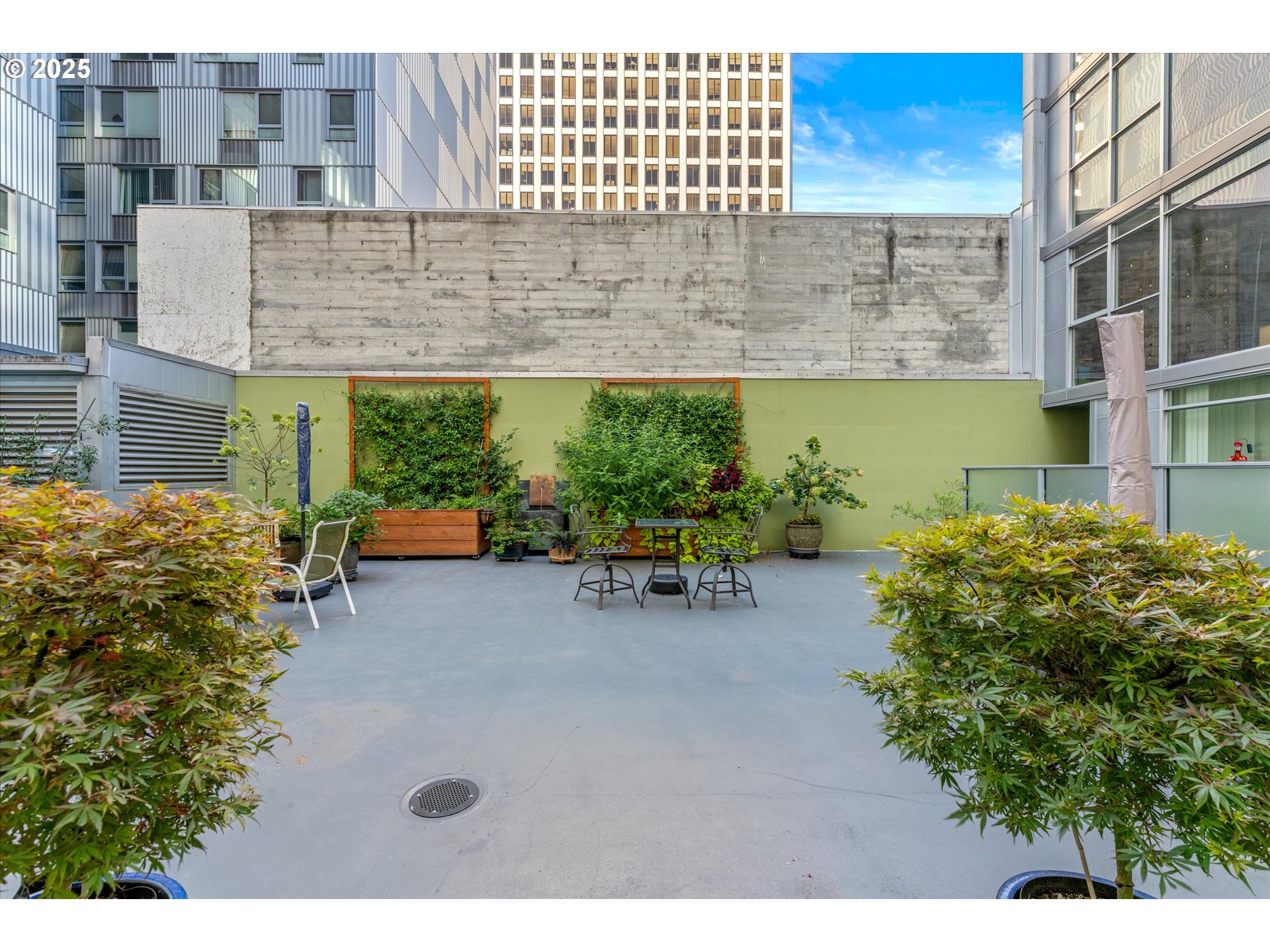 533 Northeast Holladay Street, Unit 605 Portland, OR 97232 - Photo 33 of 42 a backyard of a house with outdoor seating