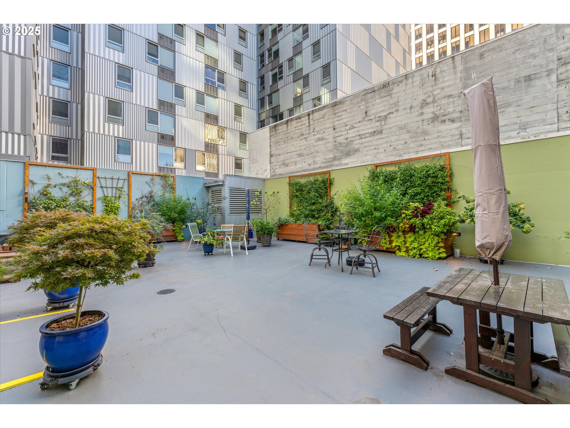 533 Northeast Holladay Street, Unit 605 Portland, OR 97232 - Photo 35 of 42 a living room with furniture and a potted plant