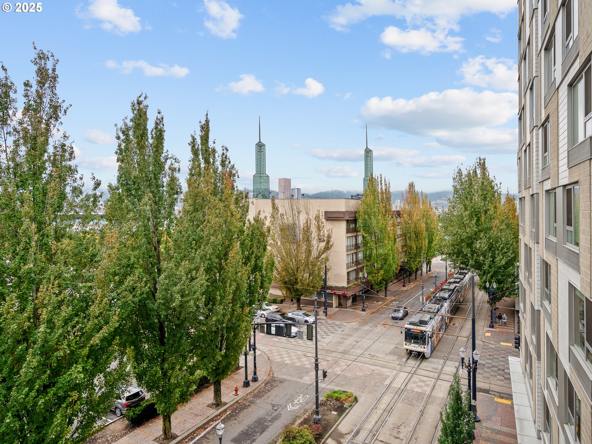 533 Northeast Holladay Street, Unit 605 Portland, OR 97232 - Photo 40 of 42 a view of outdoor space with seating area and trees in the background
