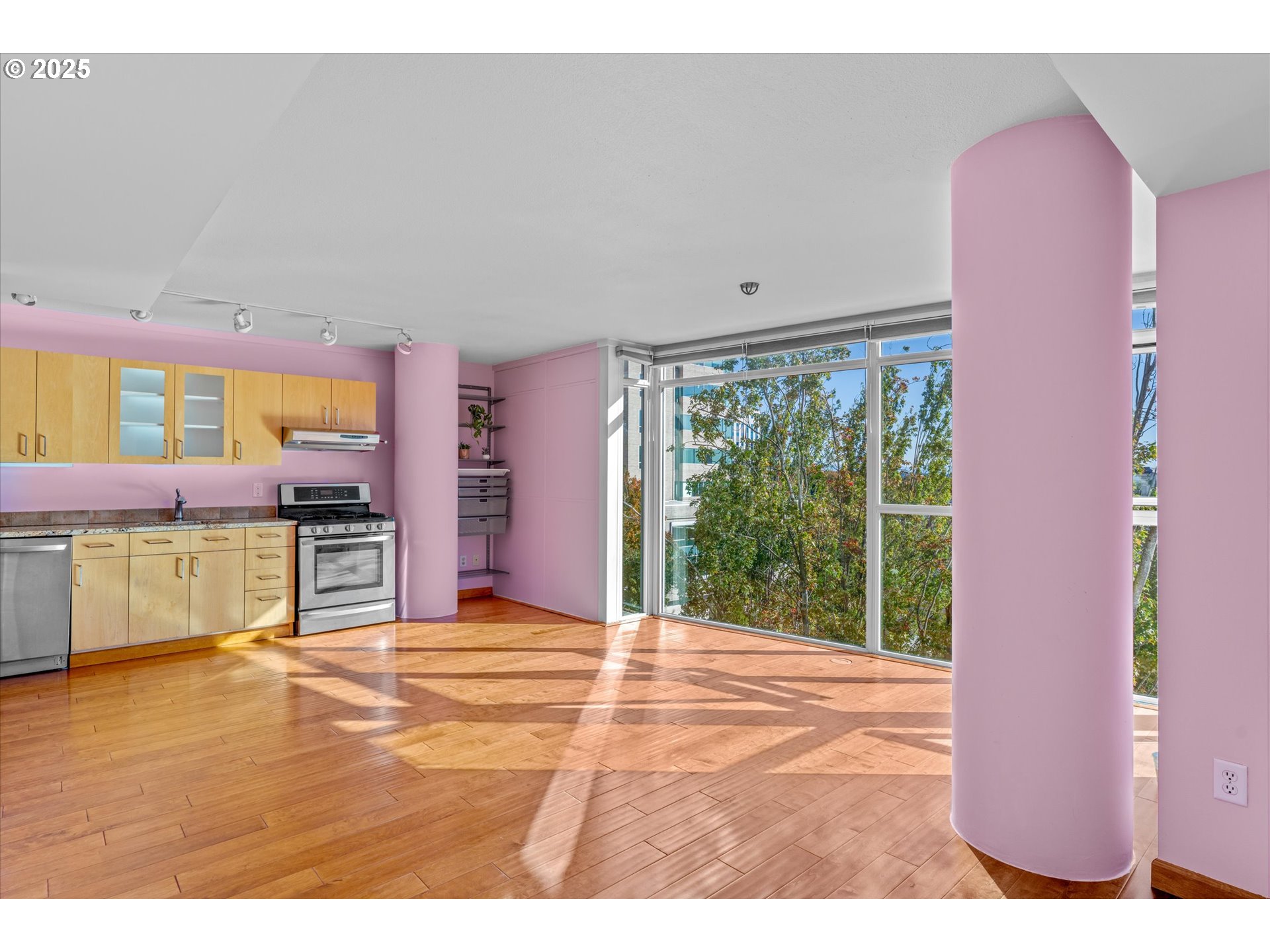 533 Northeast Holladay Street, Unit 605 Portland, OR 97232 - Photo 10 of 42 a view of a living room and kitchen with furniture