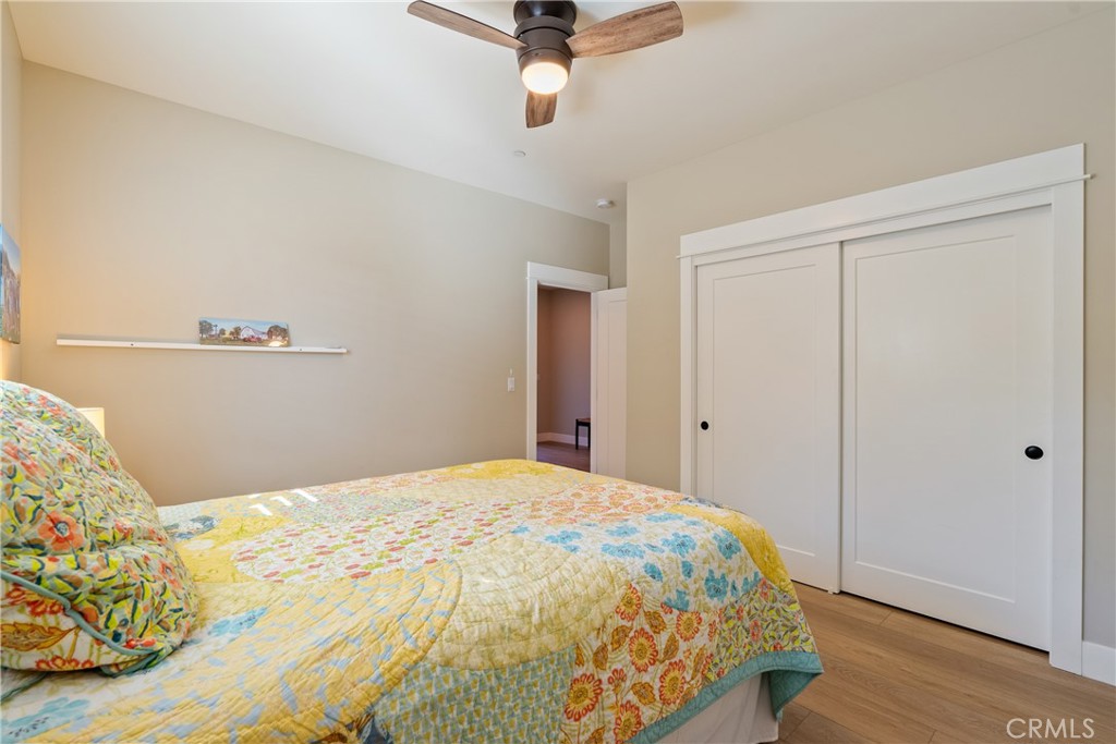 8550 El Corte Road Atascadero, CA 93422 - Photo 35 of 72 a bedroom with a bed and wooden floor