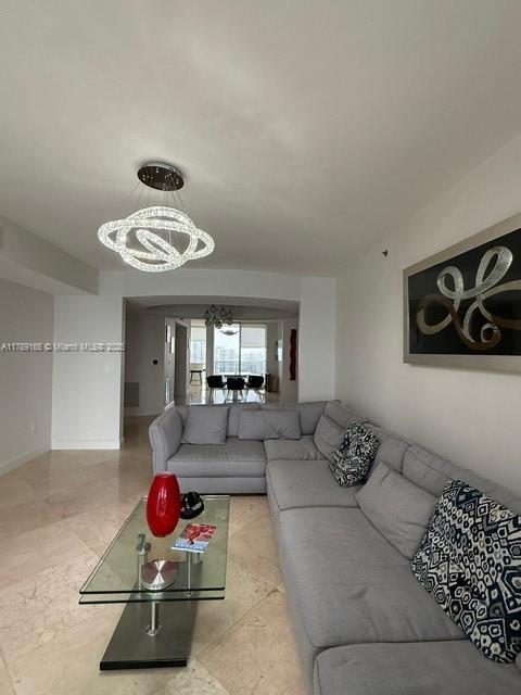 18911 Collins Avenue, Unit 2804 Sunny Isles Beach, FL 33160 - Photo 15 of 38 a view of a livingroom with furniture and a couch