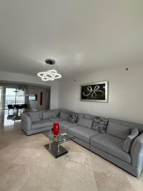 18911 Collins Avenue, Unit 2804 Sunny Isles Beach, FL 33160 - Photo 16 of 38 a view of a livingroom with furniture and a couch