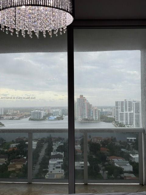18911 Collins Avenue, Unit 2804 Sunny Isles Beach, FL 33160 - Photo 18 of 38 a view of a balcony with a floor to ceiling window