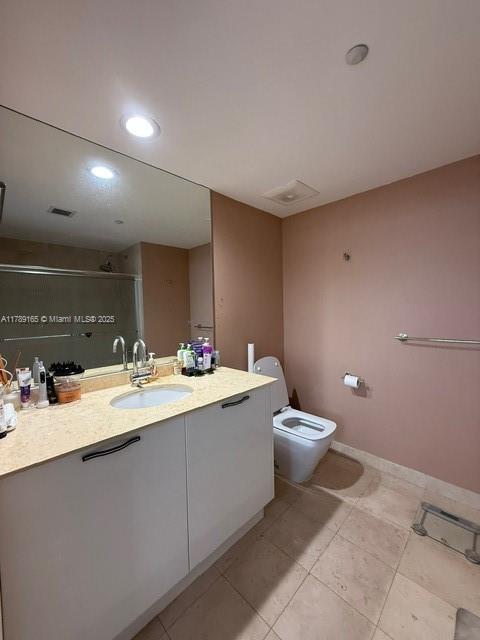 18911 Collins Avenue, Unit 2804 Sunny Isles Beach, FL 33160 - Photo 20 of 38 a bathroom with a sink and a toilet