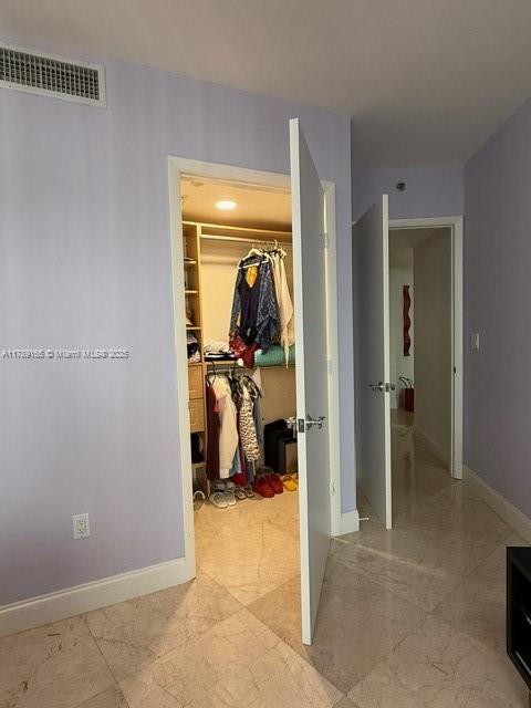18911 Collins Avenue, Unit 2804 Sunny Isles Beach, FL 33160 - Photo 24 of 38 a view of a room that has a bed