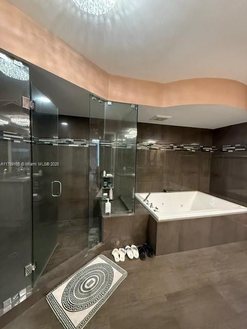18911 Collins Avenue, Unit 2804 Sunny Isles Beach, FL 33160 - Photo 31 of 38 a bathroom with a shower