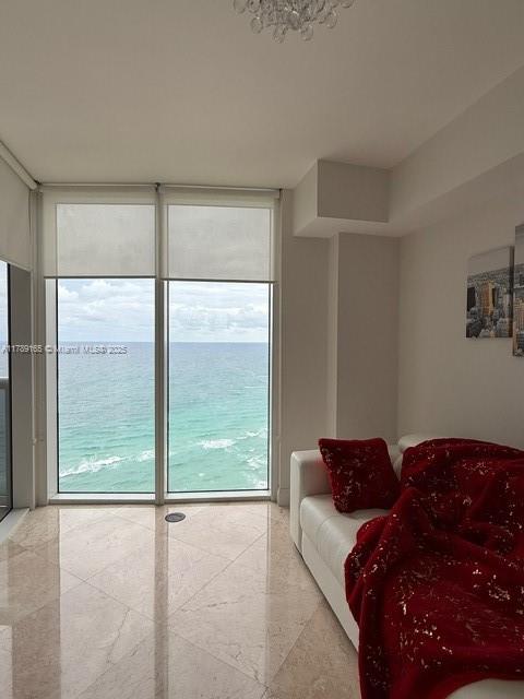 18911 Collins Avenue, Unit 2804 Sunny Isles Beach, FL 33160 - Photo 34 of 38 a living room with furniture and a large window