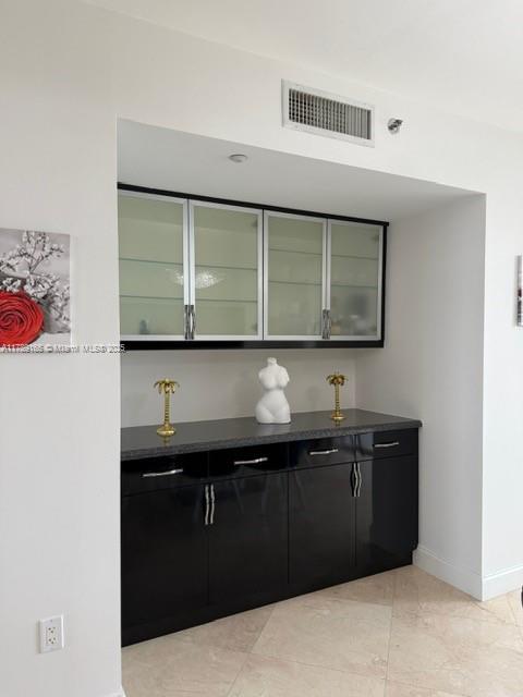 18911 Collins Avenue, Unit 2804 Sunny Isles Beach, FL 33160 - Photo 35 of 38 a kitchen with a sink and cabinets