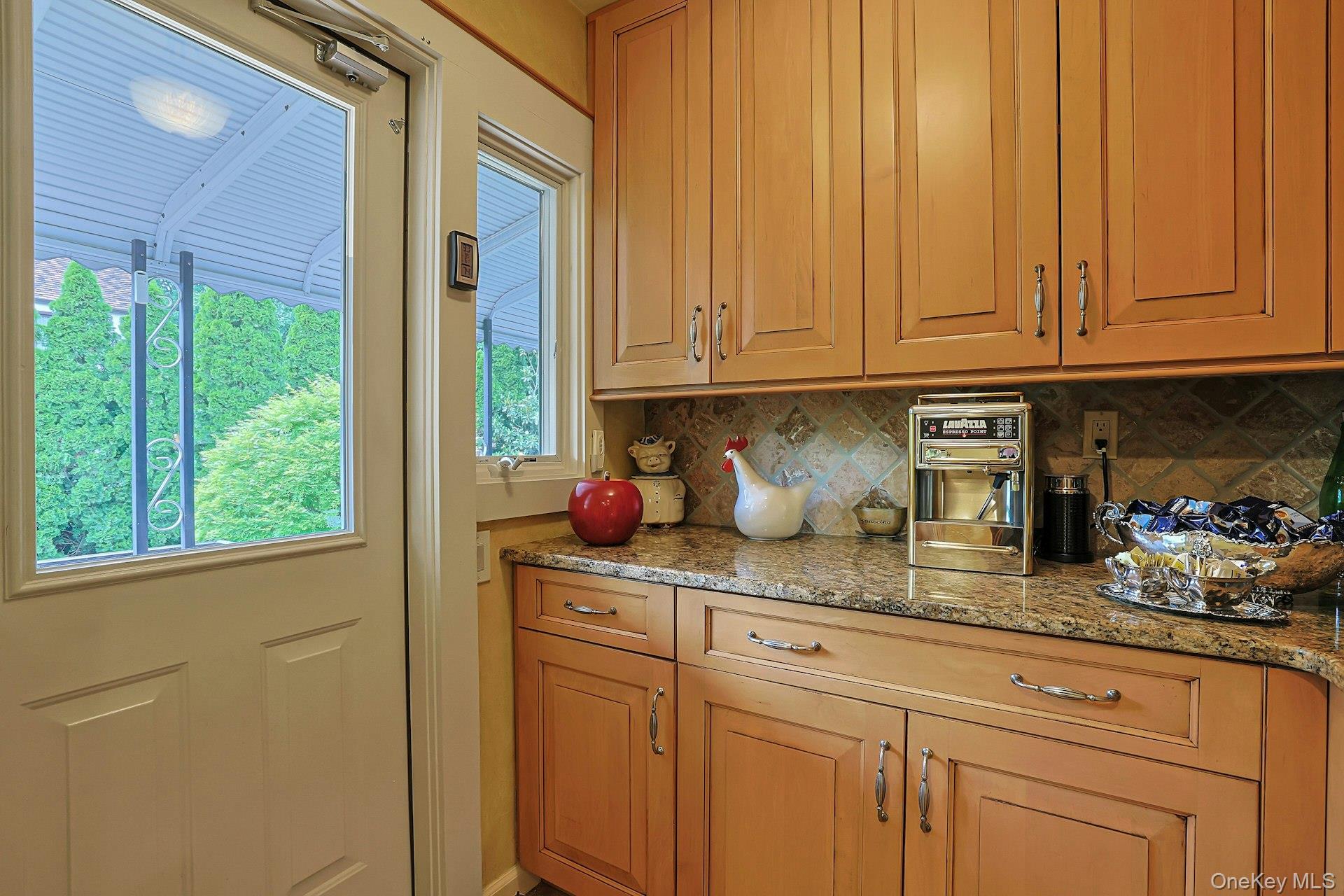72 Brookfield Road Mount Vernon, NY 10552 - Photo 15 of 46 Butler's Pantry with ample storage, extra counter space, and access to terrace leading to lower patio