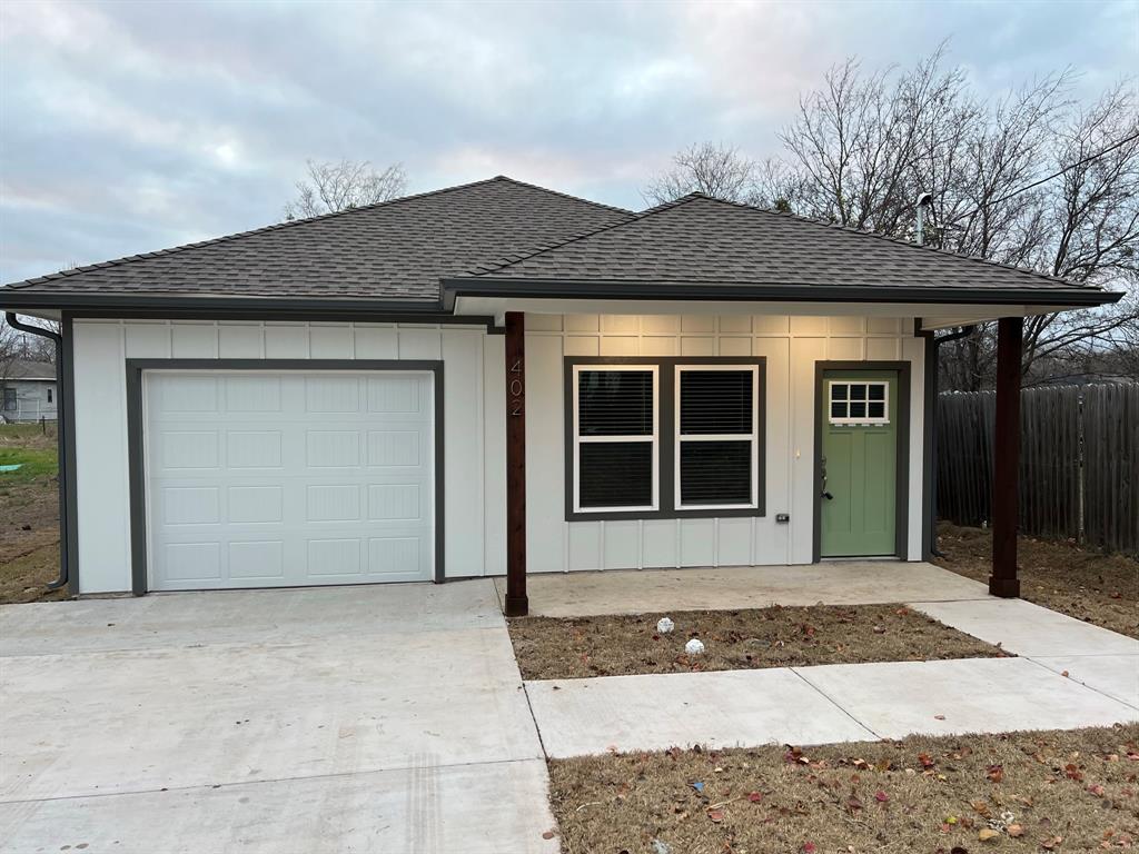 402 North Elliott Avenue Sherman, TX 75090 - Photo 1 of 19 a front view of a house