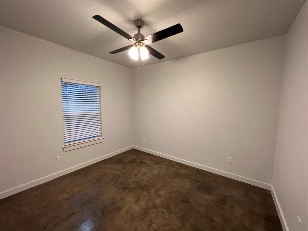 402 North Elliott Avenue Sherman, TX 75090 - Photo 14 of 19 an empty room with a window and a fan