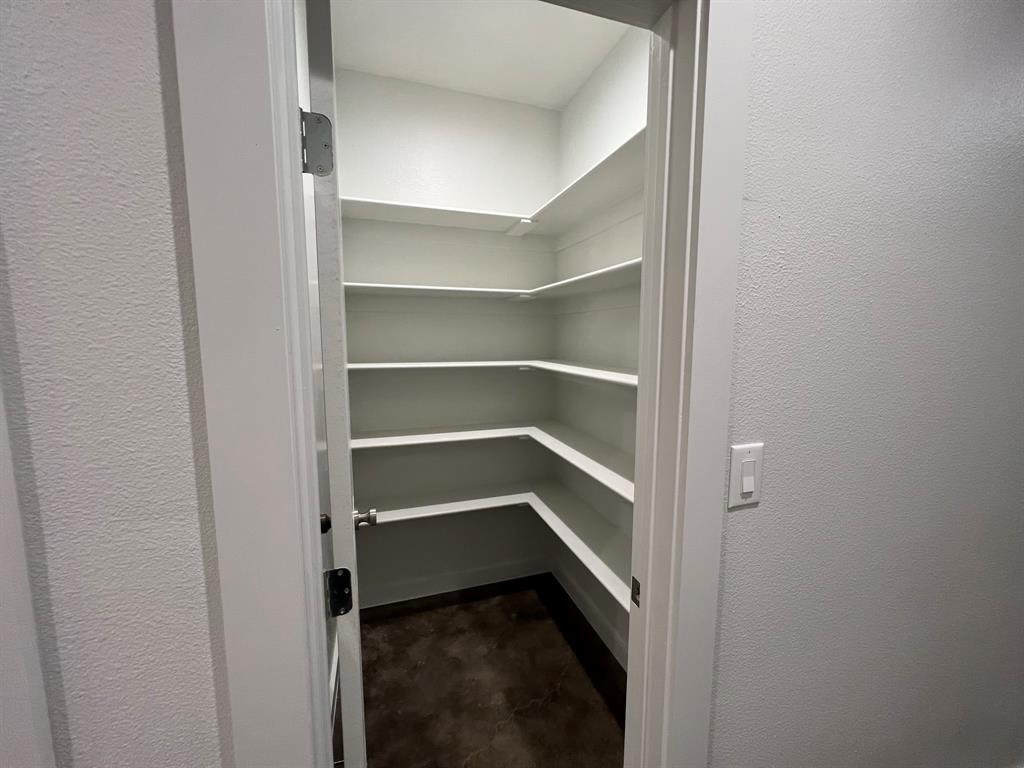 402 North Elliott Avenue Sherman, TX 75090 - Photo 5 of 19 a view of walk in closet with empty racks
