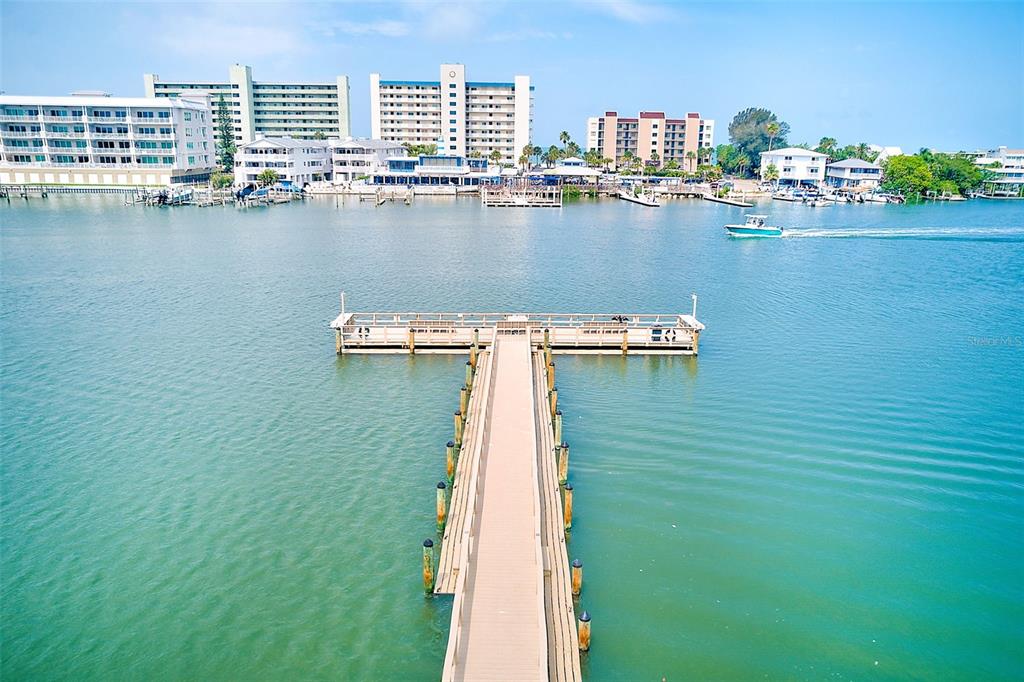 10280 Imperial Point Drive West, Unit 7 Largo, FL 33774 - Photo 11 of 51 a view of a water and a lawn chairs