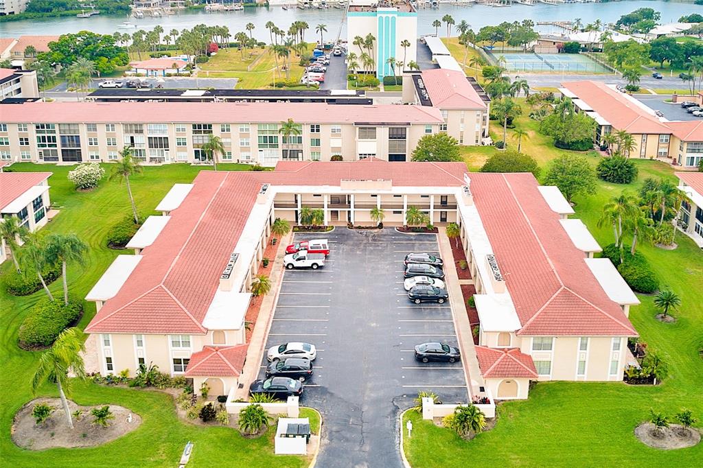 10280 Imperial Point Drive West, Unit 7 Largo, FL 33774 - Photo 2 of 51 an aerial view of multiple houses with yard