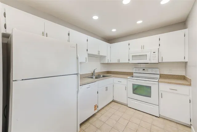 a view of an empty room and a window