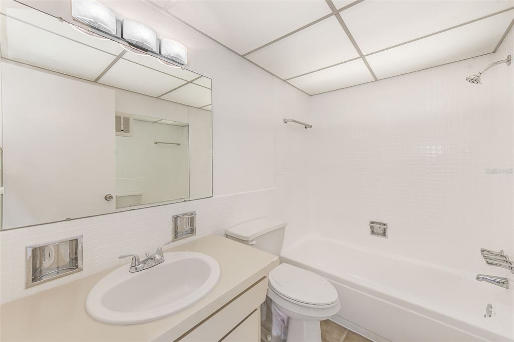 10280 Imperial Point Drive West, Unit 7 Largo, FL 33774 - Photo 26 of 51 a bathroom with a sink toilet and shower