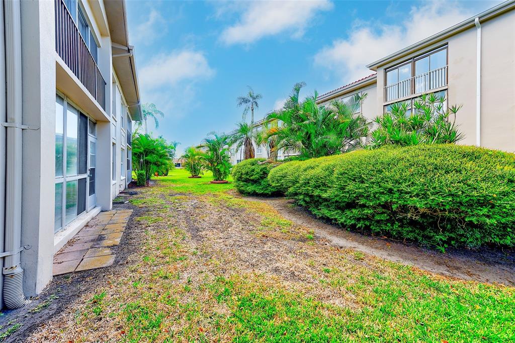 10280 Imperial Point Drive West, Unit 7 Largo, FL 33774 - Photo 37 of 51 a view of a pathway both side of house
