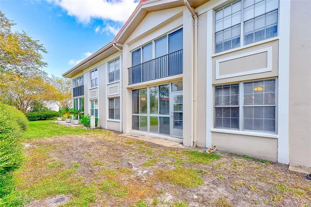 front view of a brick house with a large windows