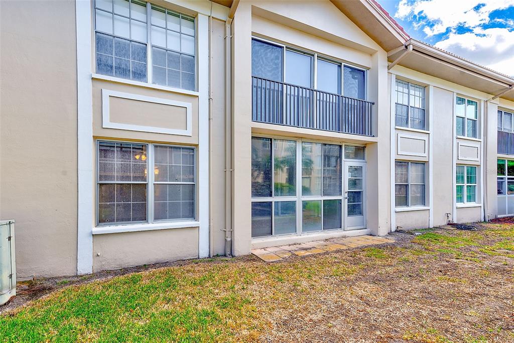 10280 Imperial Point Drive West, Unit 7 Largo, FL 33774 - Photo 40 of 51 front view of a brick house with a large windows
