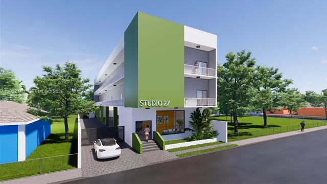 a view of a building with a yard