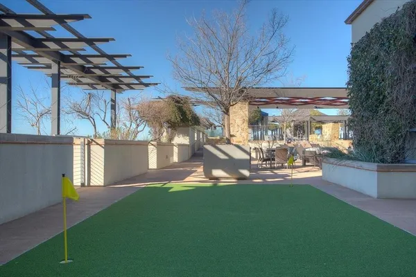 a view of a house with backyard porch and sitting area