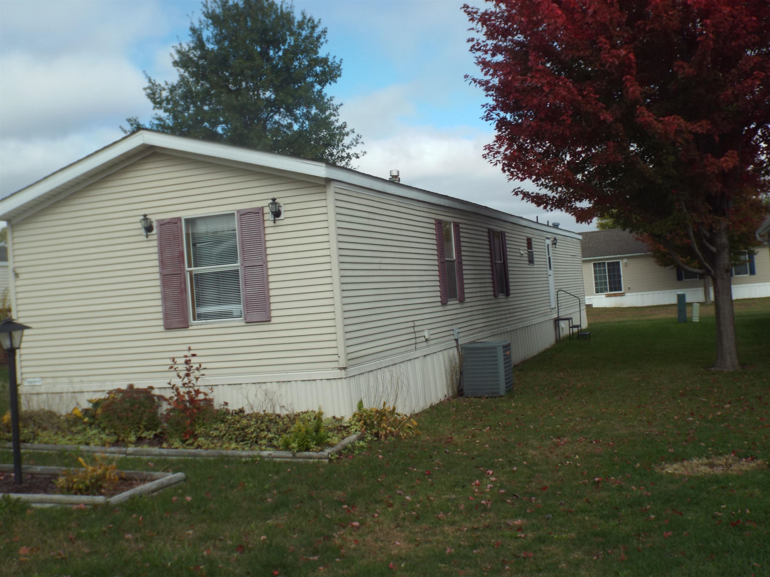 108 Starlight Drive Freeport, IL 61032 - Photo 17 of 19 a view of a backyard with plants and large tree