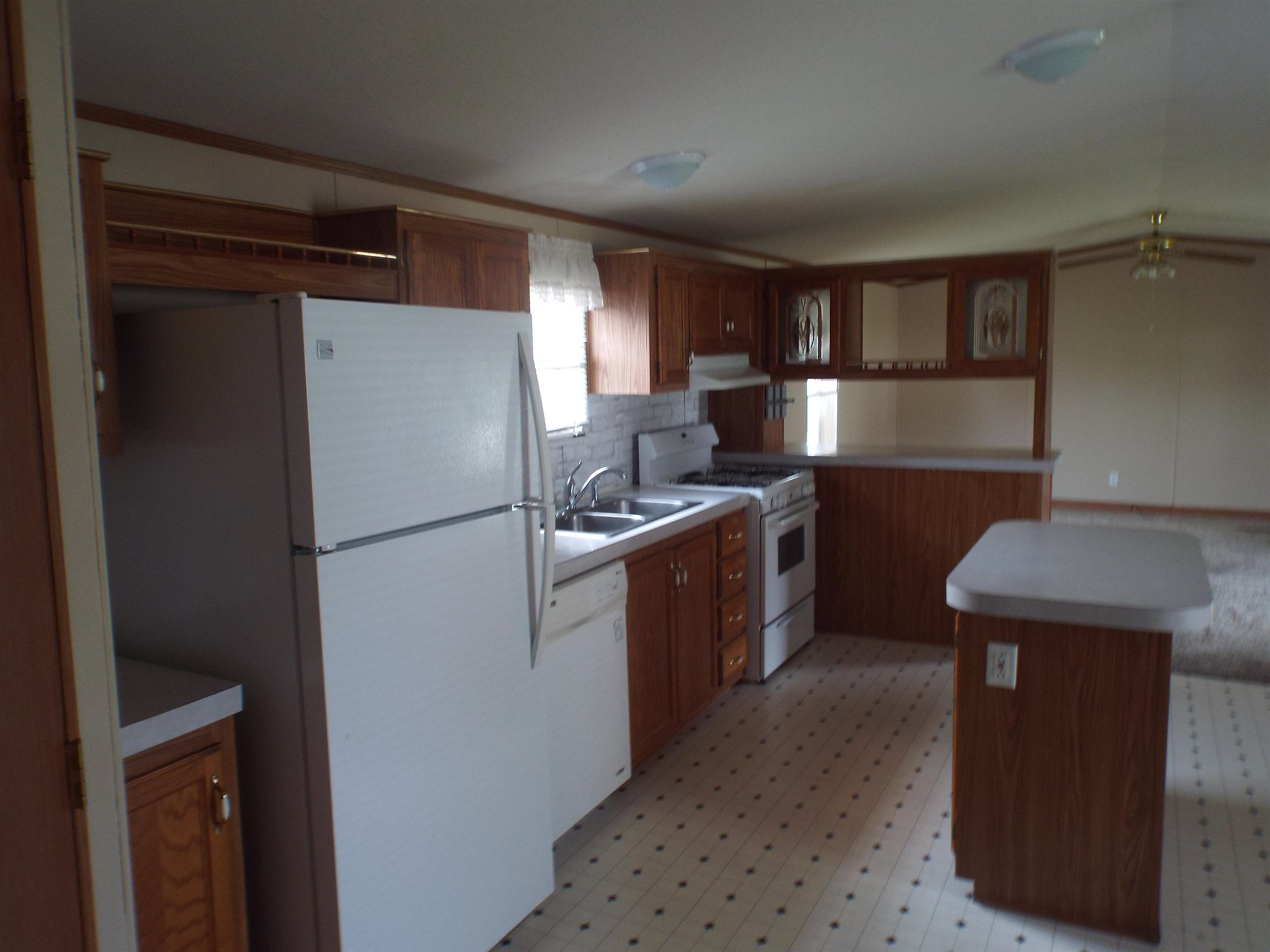 108 Starlight Drive Freeport, IL 61032 - Photo 3 of 19 a kitchen with a refrigerator a washer and dryer