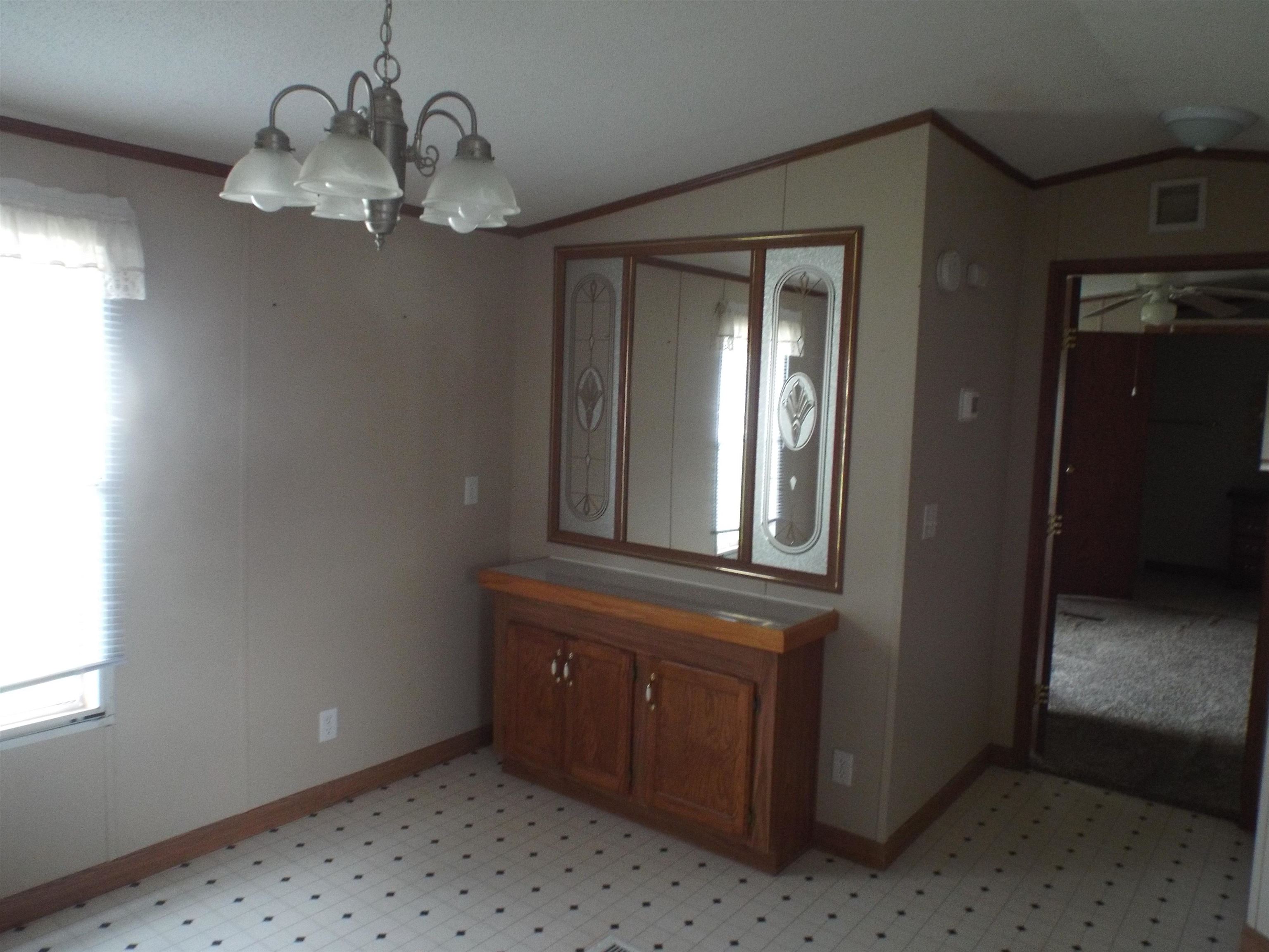 108 Starlight Drive Freeport, IL 61032 - Photo 5 of 19 a view of a hallway with chandelier