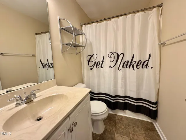 a bathroom with a sink and toilet