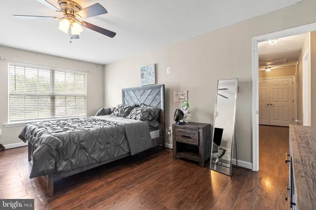 a bedroom with bed and a chandelier