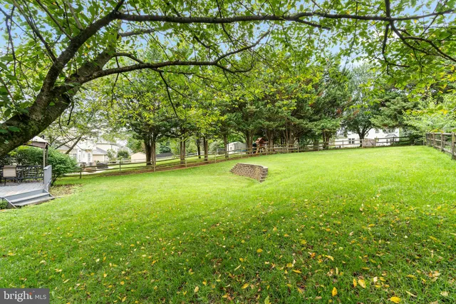 a view of outdoor space with deck and yard