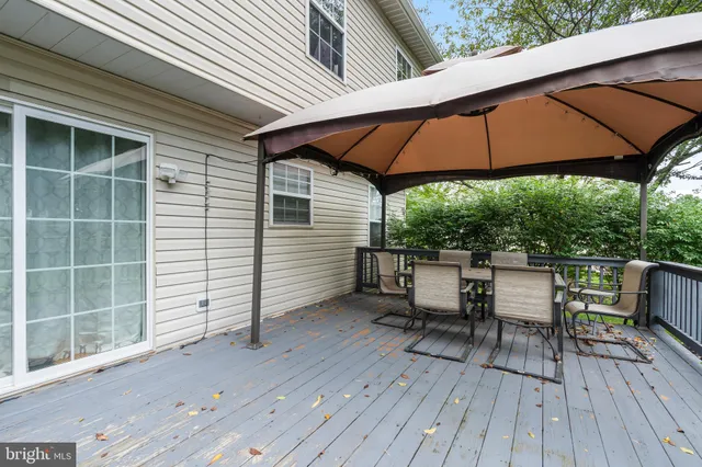 a view of balcony with chairs and wooden floor