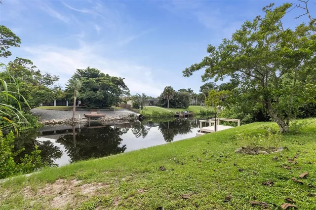 a view of a backyard with sitting area