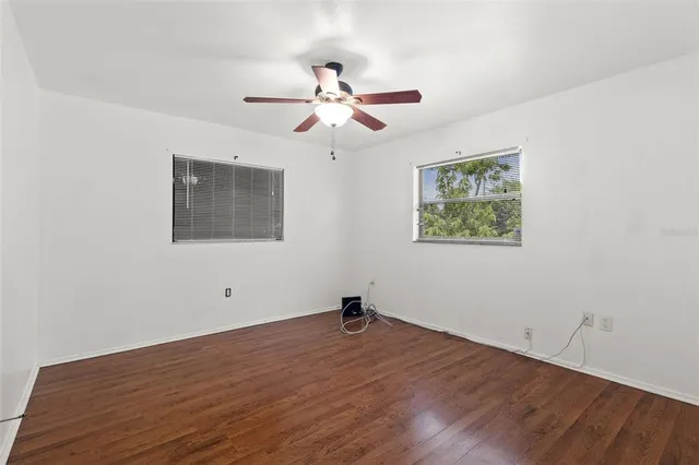 a view of a livingroom with a chair and dining table chair