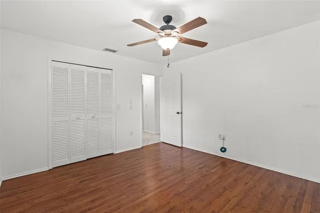 a swimming pool with outdoor seating and yard