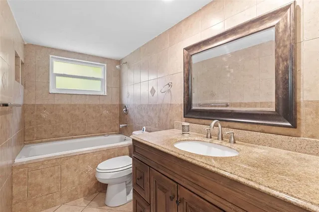 a view of a backyard with large trees