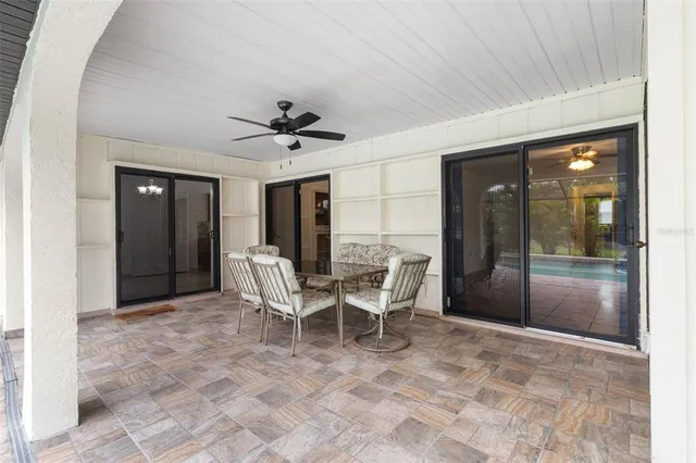 a view of a house with backyard and a garden
