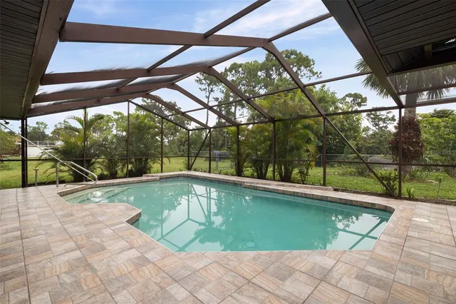 an aerial view of residential house with outdoor space and street view