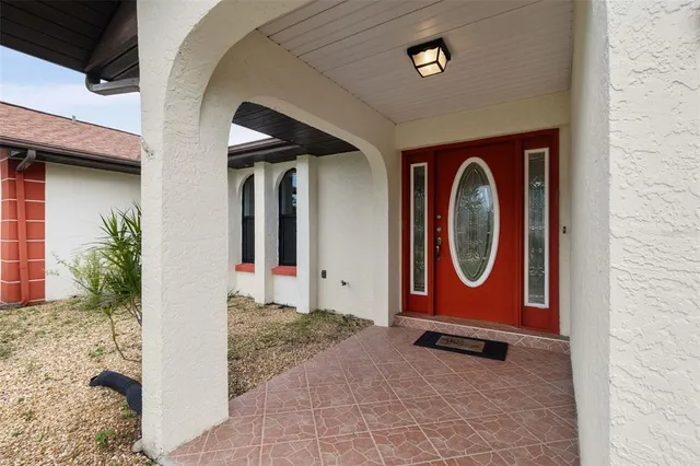 a room with chandelier and furniture