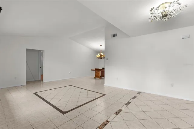 a kitchen with granite countertop a sink a stove and cabinets