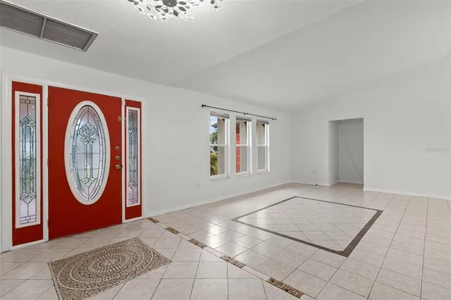 a kitchen with granite countertop a sink and cabinets