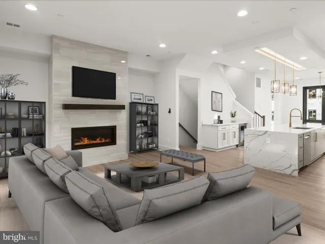 a view of an empty room with window and fire place