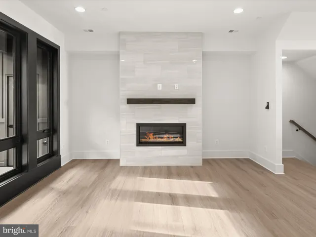 a kitchen with stainless steel appliances kitchen island granite countertop a sink stove and refrigerator