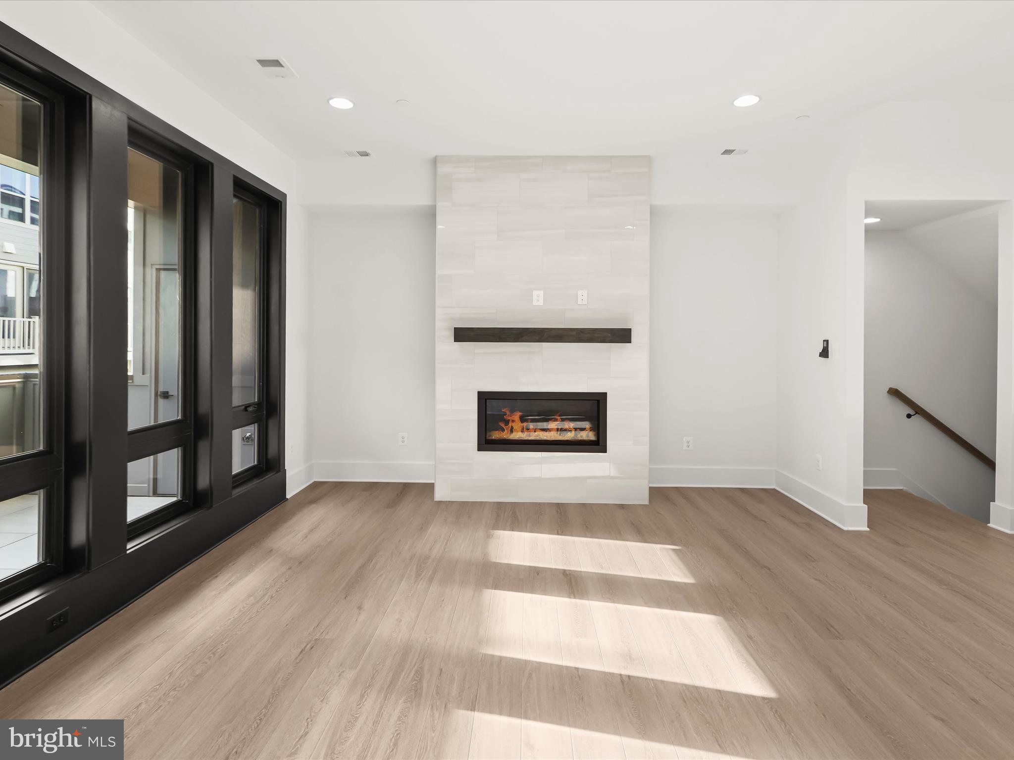 14920 Dispatch Street Rockville, MD 20850 - Photo 15 of 85 a view of an empty room with window and fire place