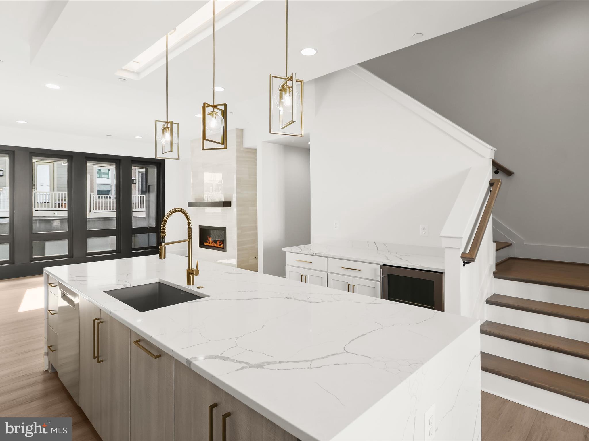 14920 Dispatch Street Rockville, MD 20850 - Photo 17 of 85 a kitchen with stainless steel appliances kitchen island a white counter space a sink and cabinets