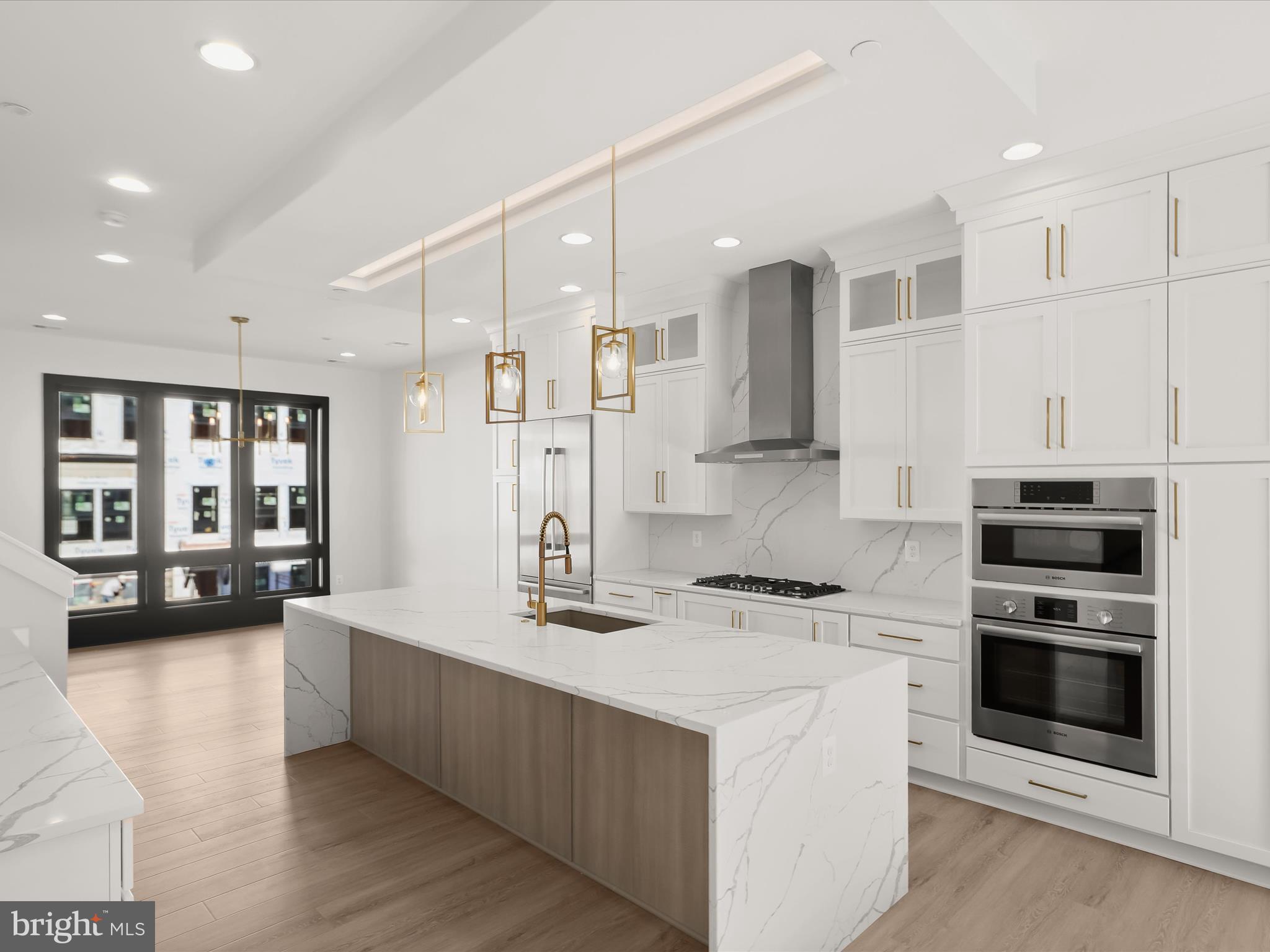 14920 Dispatch Street Rockville, MD 20850 - Photo 18 of 85 a kitchen with stainless steel appliances kitchen island granite countertop a sink stove and refrigerator